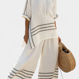 Magdalena – top asimetric, sofisticat cu dungi și pantaloni îndrăzneți